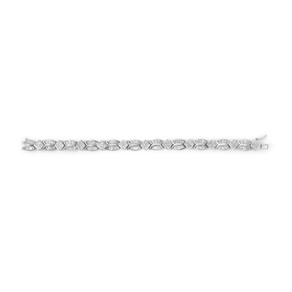White bracelet with alternating baguette and princess shaped white gemstones in a horizontal top-down view displayed on a white background.
