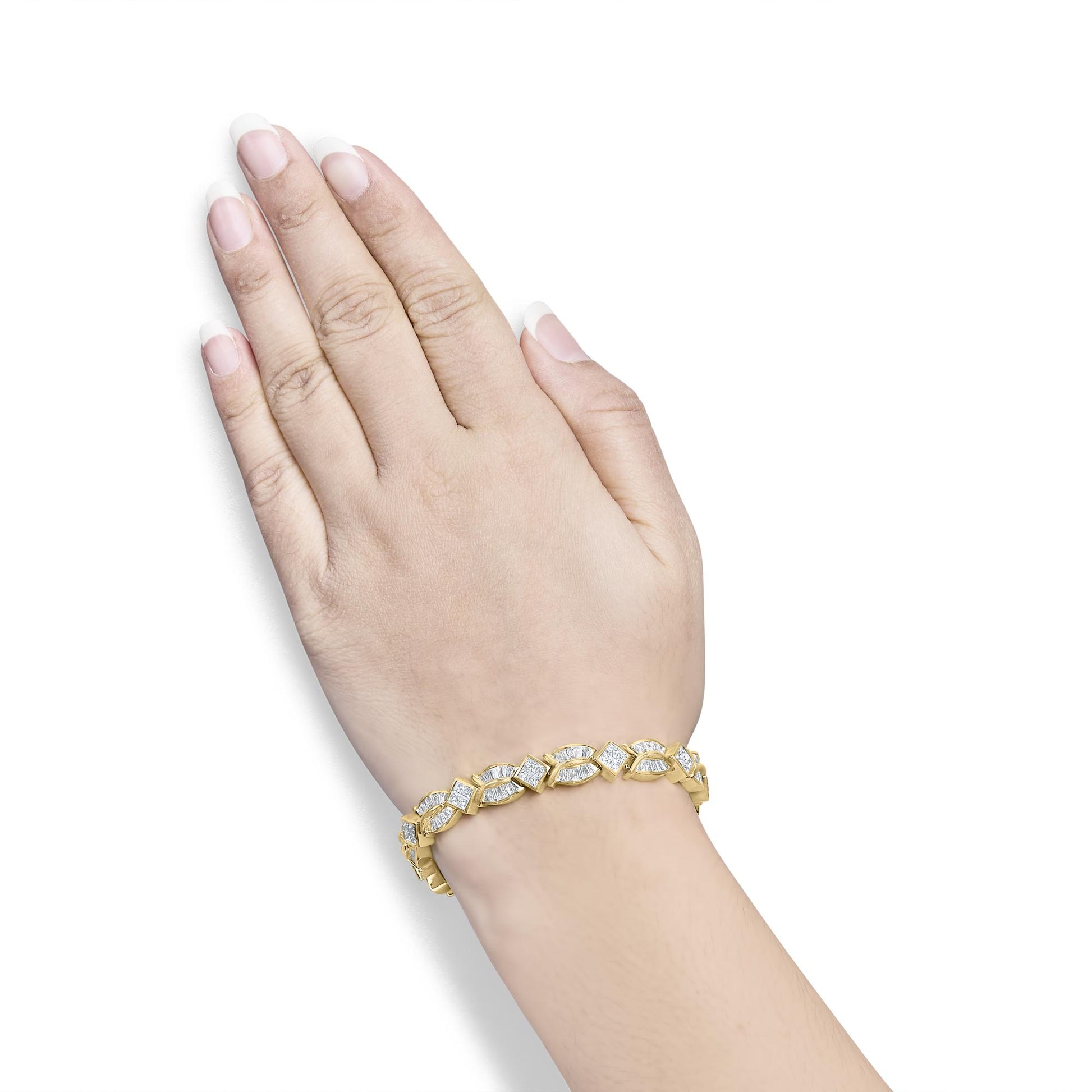 Yellow metal bracelet with alternating square and elongated shapes set with white gemstones, shown worn on a model's wrist in a top-down angle.