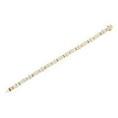 Yellow metal bracelet with alternating sections of white baguette-shaped gemstones in a channel setting and white princess-shaped gemstones in an invisible setting, shown flat on a white background from a top-down angle.