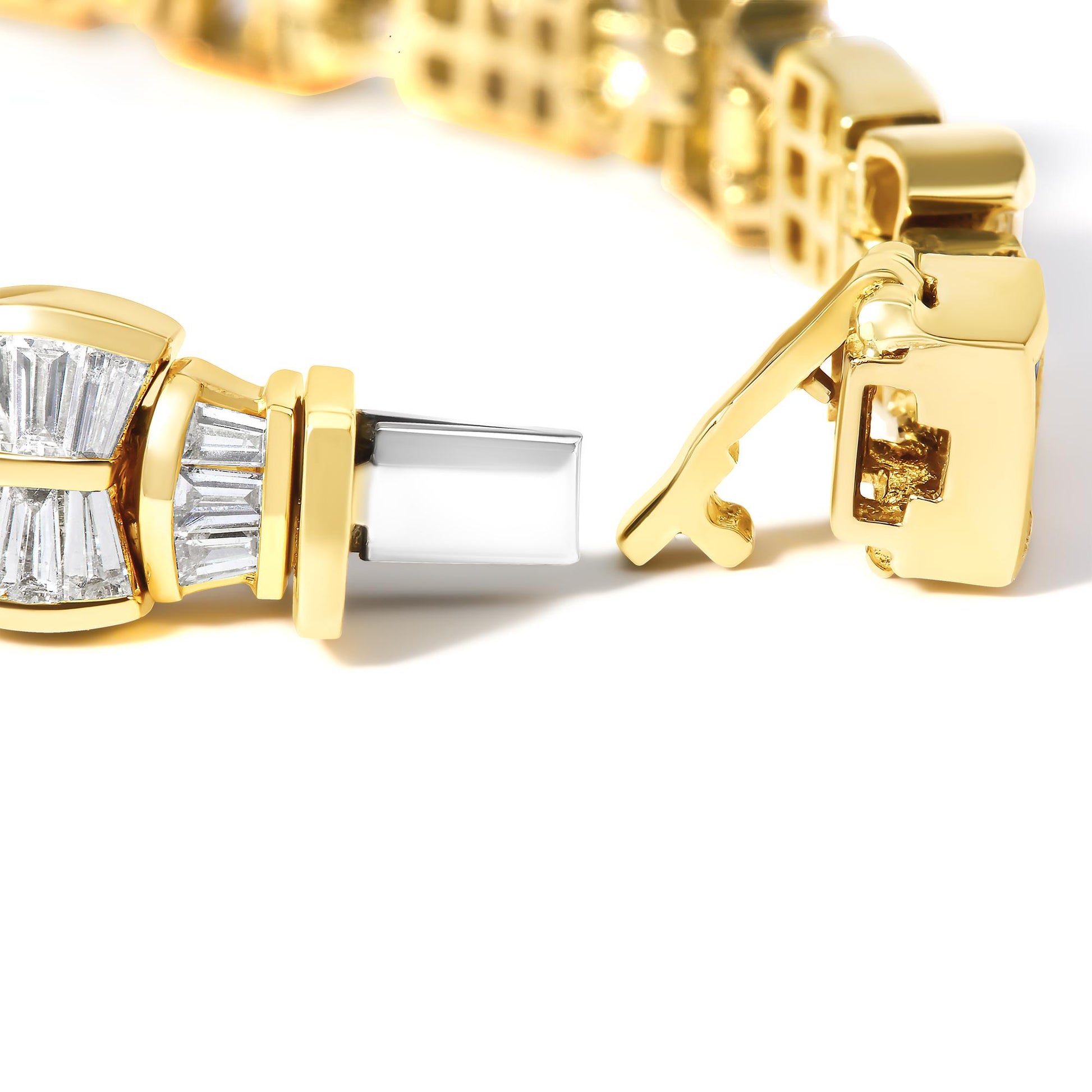 Close-up front angle of a yellow bracelet with a clasp open, featuring white gemstones in baguette shape with channel setting and princess shape with invisible setting.