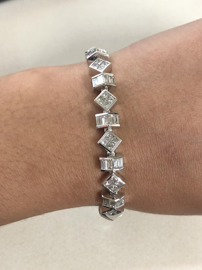 White metal bracelet featuring alternating baguette and princess shape white gemstones, shown worn on a model’s wrist, photographed from a top angle.