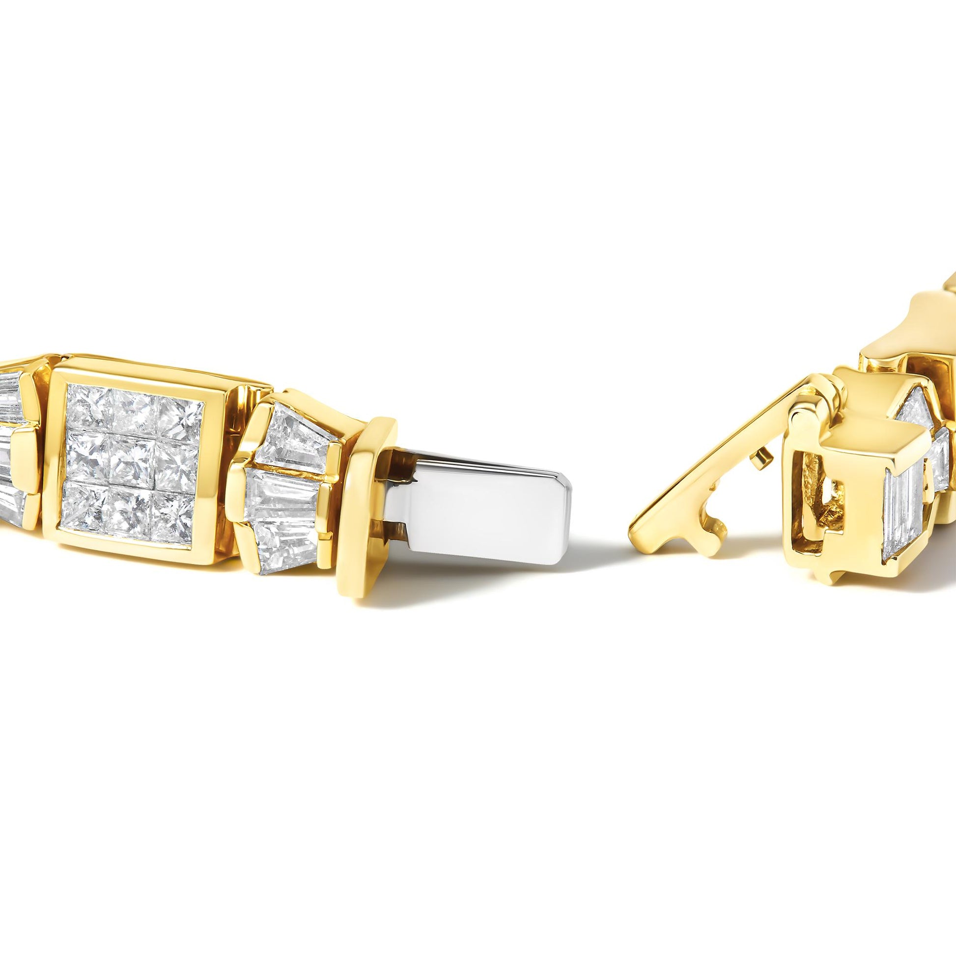 Close-up angled view of a yellow metal bracelet clasp featuring white baguette-shaped gemstones in channel settings and white princess-shaped gemstones in invisible settings.