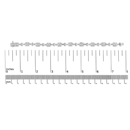 White metal bracelet with alternating princess-shaped and baguette-shaped white gemstones shown horizontally on a measurement scale, top view.