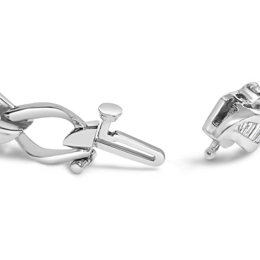 Close-up side angle of a white metal bracelet clasp with visible channel-set white baguette-shaped gemstones.