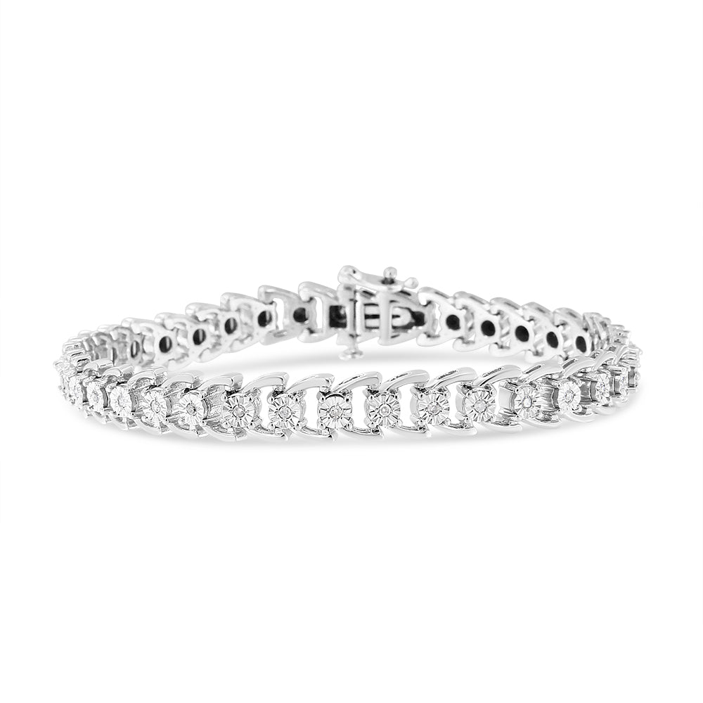 White metal bracelet with round white gemstones in miracle setting, shown from a front angle on a white background.