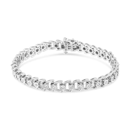 White metal bracelet with round white gemstones in miracle settings, shown from an angled top view.
