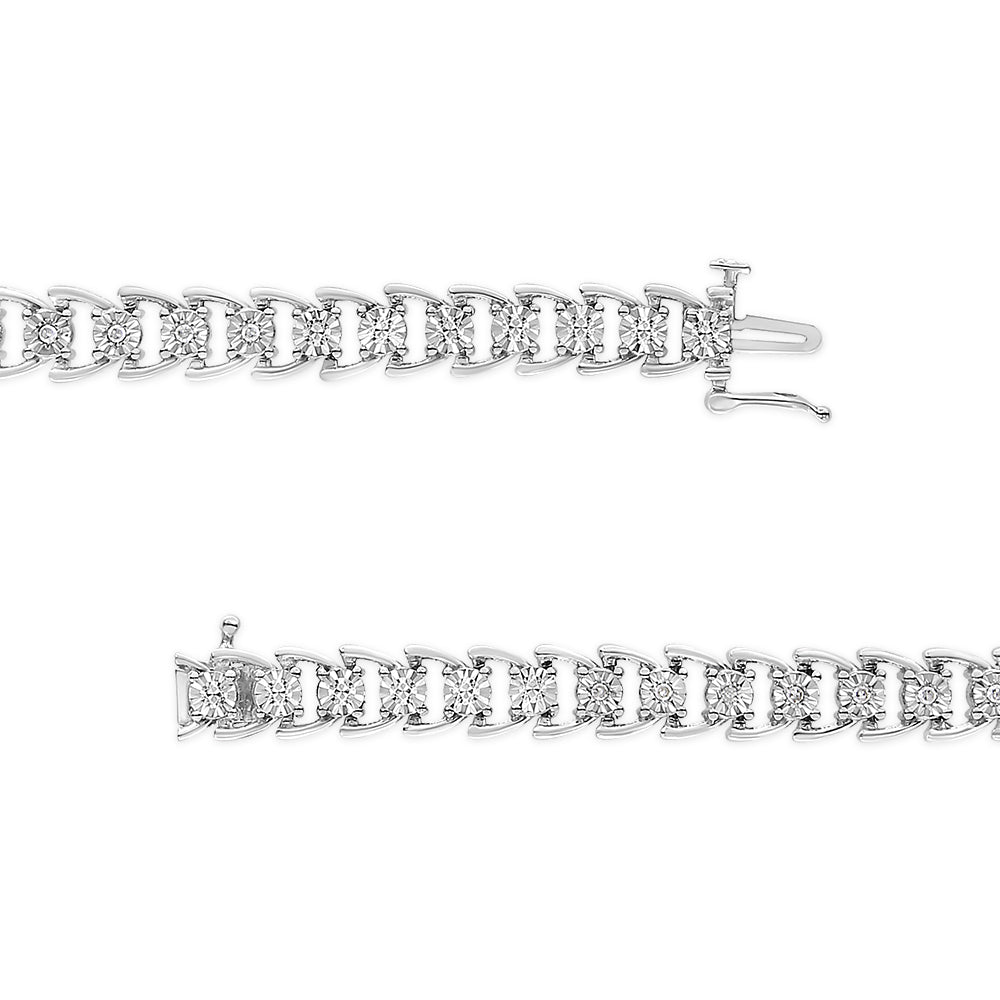 Top view of a white metal bracelet with round white gemstones in a miracle setting, shown partially unclasped on a white background.