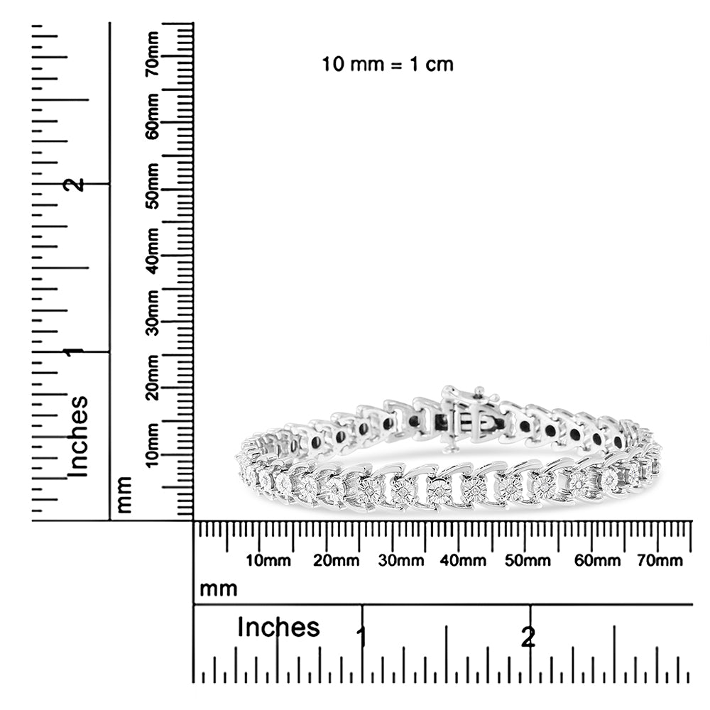 White bracelet with round white gemstones in miracle setting, photographed at front angle, placed on a ruler for size reference.