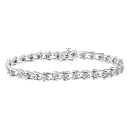 White metal bracelet with round white gemstones in a miracle setting, shown from a side angle.