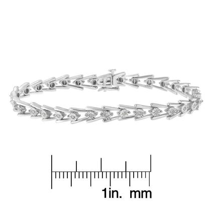 Bracelet with white round gemstones in a miracle setting on a white metal band, shown from side angle above a ruler for size reference.
