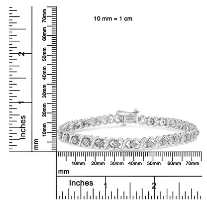 White metal bracelet with round white gemstones in miracle setting, shown on a ruler for size reference, front angle.