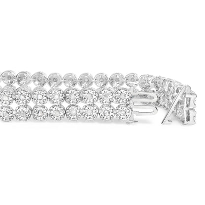 Close-up side view of a white metal bracelet featuring two rows of round white gemstones in miracle settings, shown unclasped.
