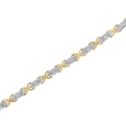 Two-toned bracelet with a twisted design featuring round white gemstones in a miracle setting, shown in a diagonal close-up angle.