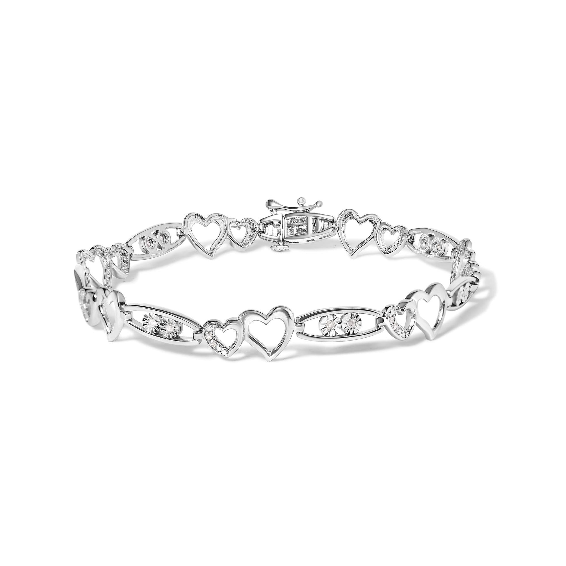 White metal heart-link bracelet with round white gemstones in prong settings, shown from a front-facing angle on a white background.