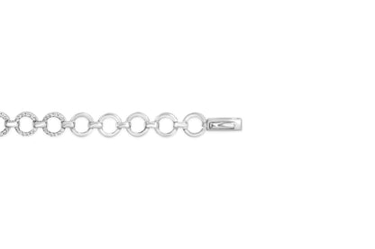 Close-up, top view of a white metal bracelet with circular links; some links are decorated with round white gemstones in prong settings.