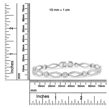 White metal bracelet with alternating round and marquise shapes set with white gemstones, shown in a front-facing shot on a ruler for size reference.
