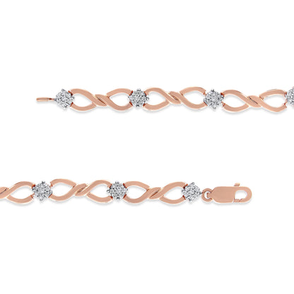 Close-up front view of a rose-colored bracelet with an intertwined link design, featuring round-shaped white gemstones in a pave setting spaced evenly along the chain, shown laid flat on a white background.