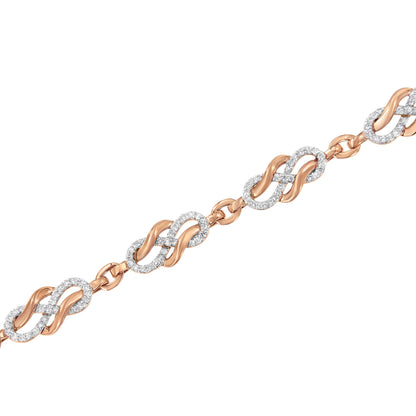 Diagonal close-up of a rose metal bracelet with intertwined links featuring round white gemstones in pave setting.