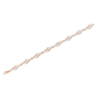 Bracelet with rose metal and linked twisted oval shapes, featuring pave-set round white gemstones, shown from a top flat angle.