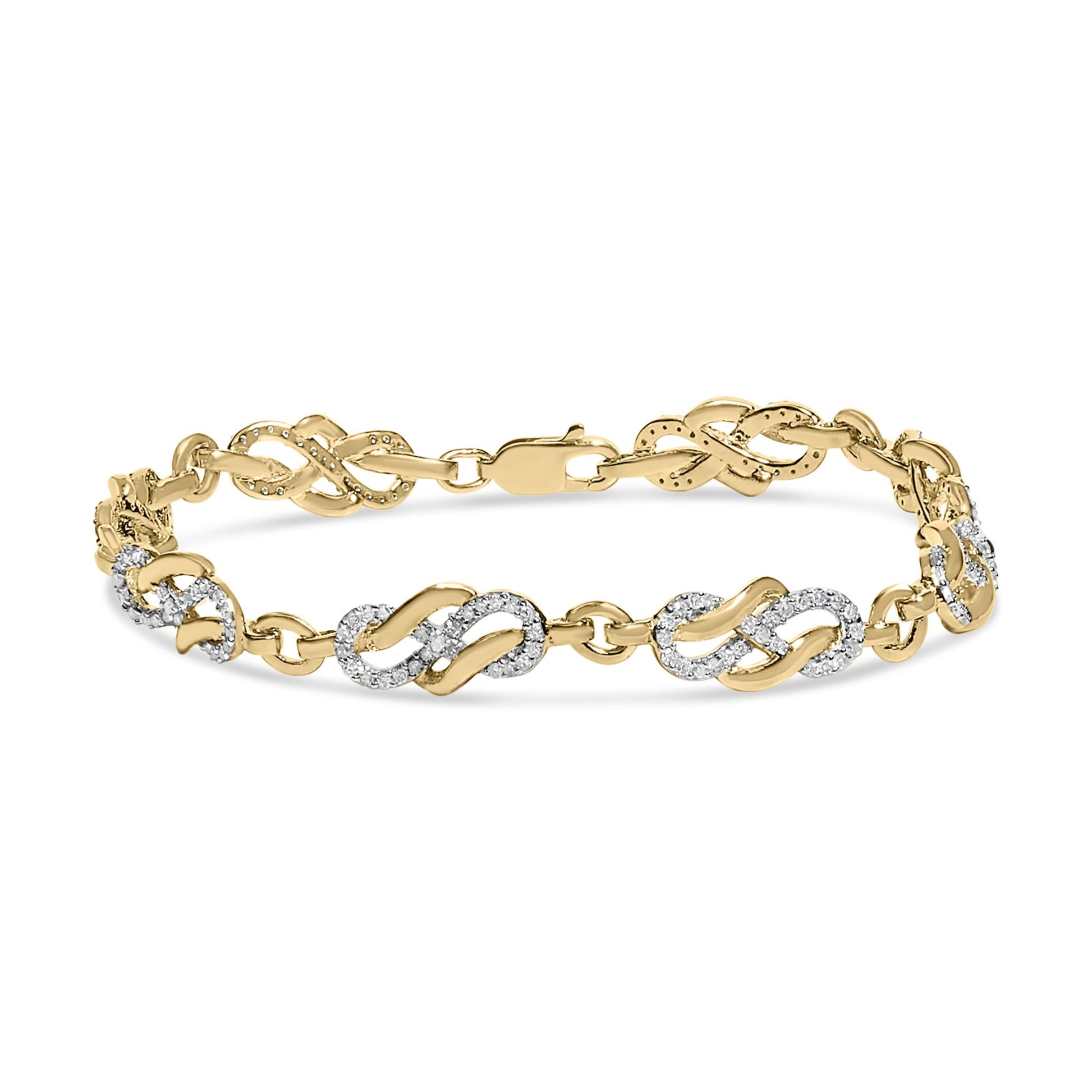 Yellow metal bracelet with alternating infinity-shaped links, some decorated with pave-set round white gemstones, shown in a front angled view.