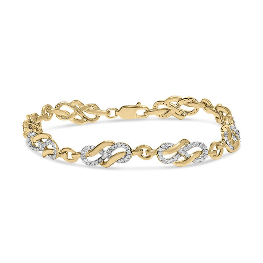 Yellow metal bracelet with alternating infinity-shaped links, some decorated with pave-set round white gemstones, shown in a front angled view.