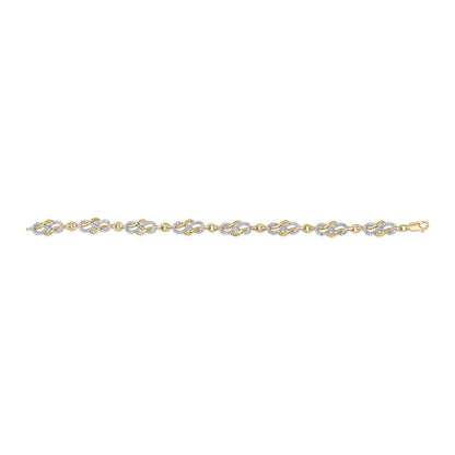 Yellow bracelet with linked oval and curved shapes, some set with white round pave gemstones, shown in a top-down flat lay angle.