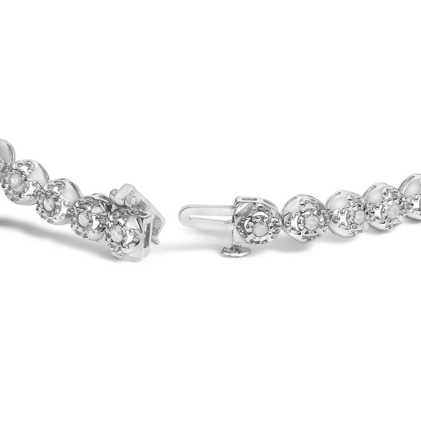 Close-up front angle of a white metal bracelet featuring round white gemstones in prong settings, with the clasp visible.