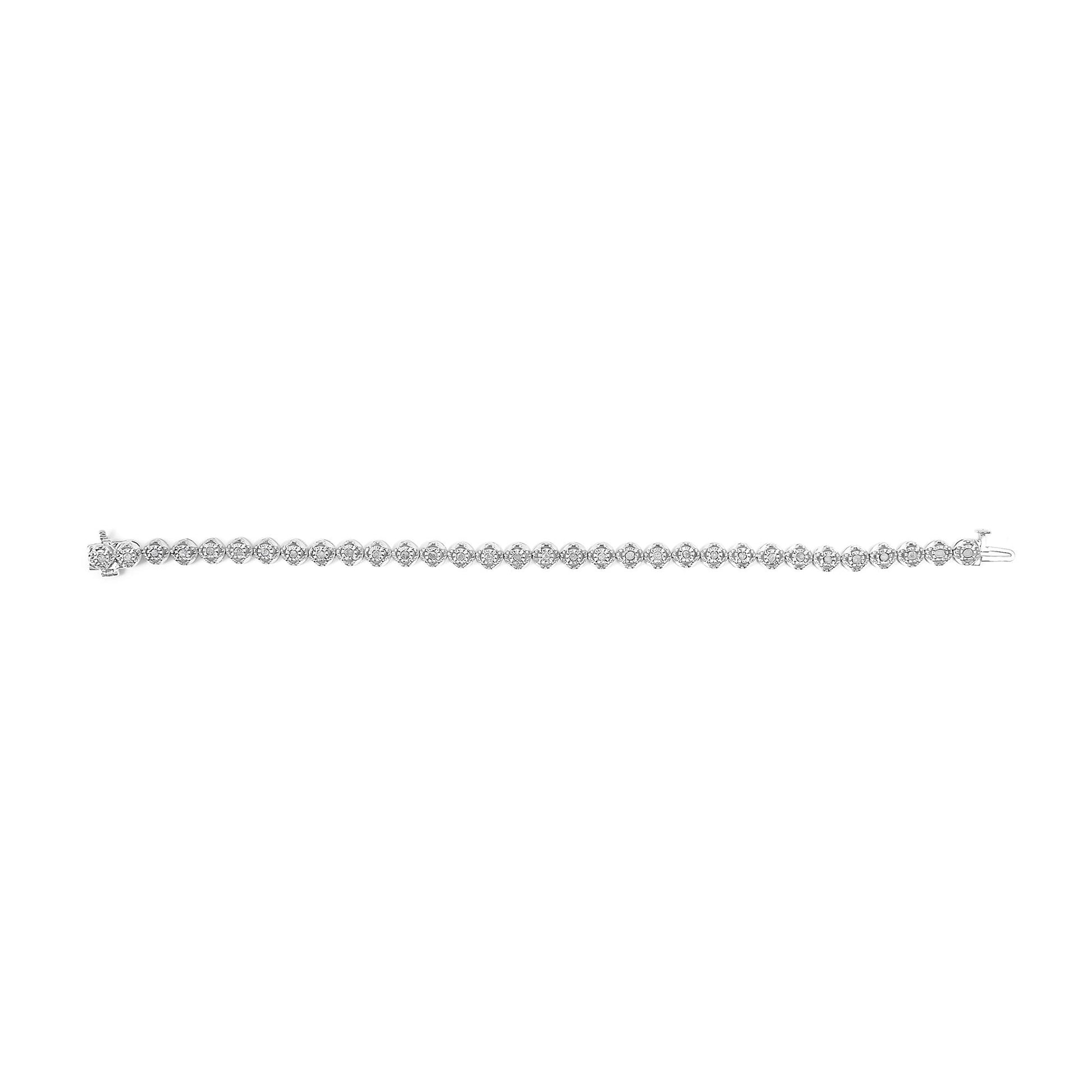 White metal bracelet with round white gemstones in prong settings, shown in a top-down view.