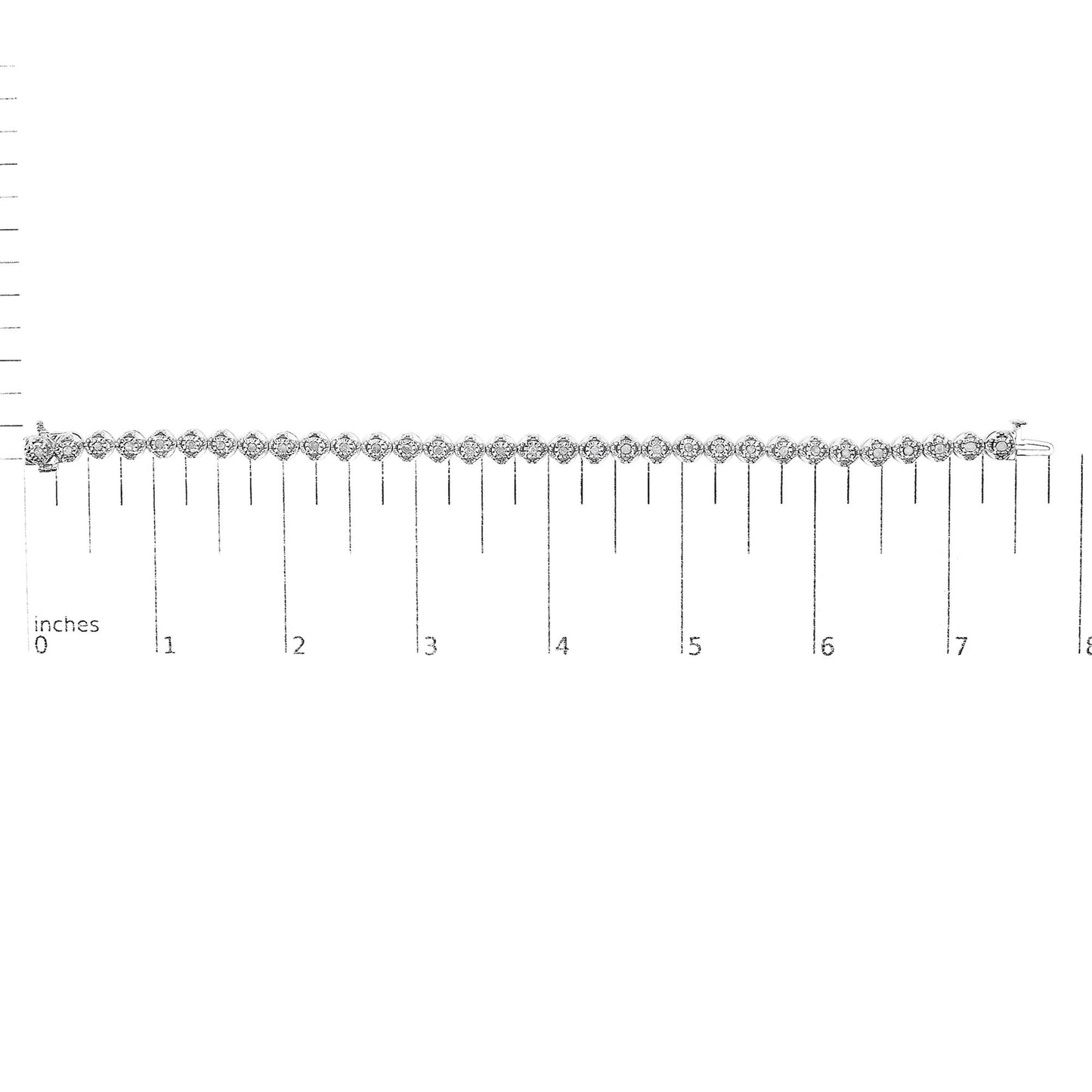 White metal bracelet with round white gemstones in prong settings, laid flat on a ruler for size reference, viewed from above.