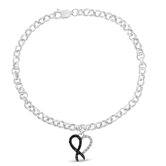 White metal chain bracelet with a heart-shaped charm featuring alternating white and black round prong-set gemstones, shot from the front.