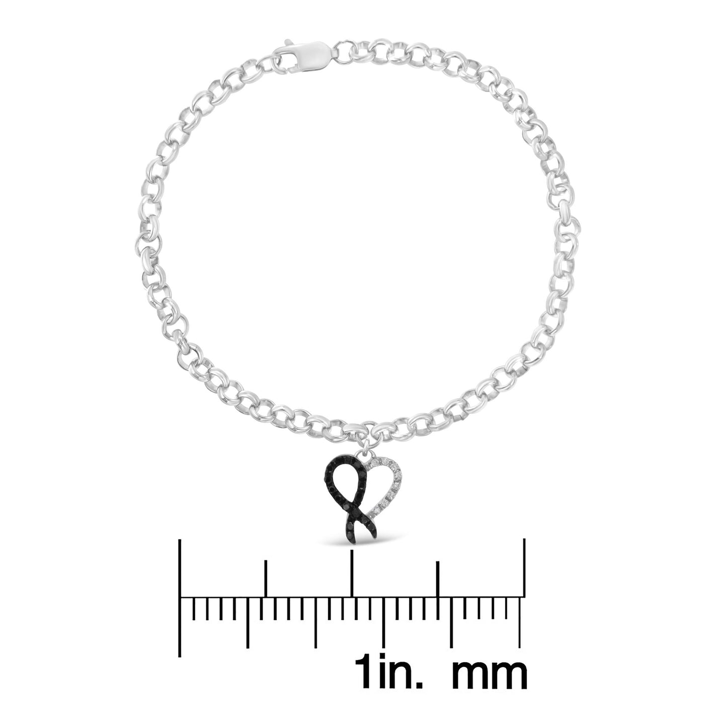 White metal bracelet with a heart-shaped charm featuring black and white round gemstones in prong settings, shown from the top angle on a ruler for size reference.