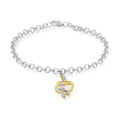 Two-toned bracelet with round white gemstones in a prong setting on a heart-shaped charm, shown from a top-down angle.