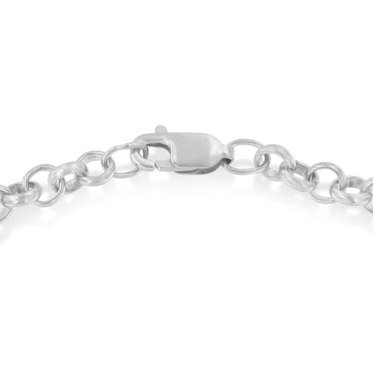 Close-up top view of a two-toned bracelet clasp and chain links.