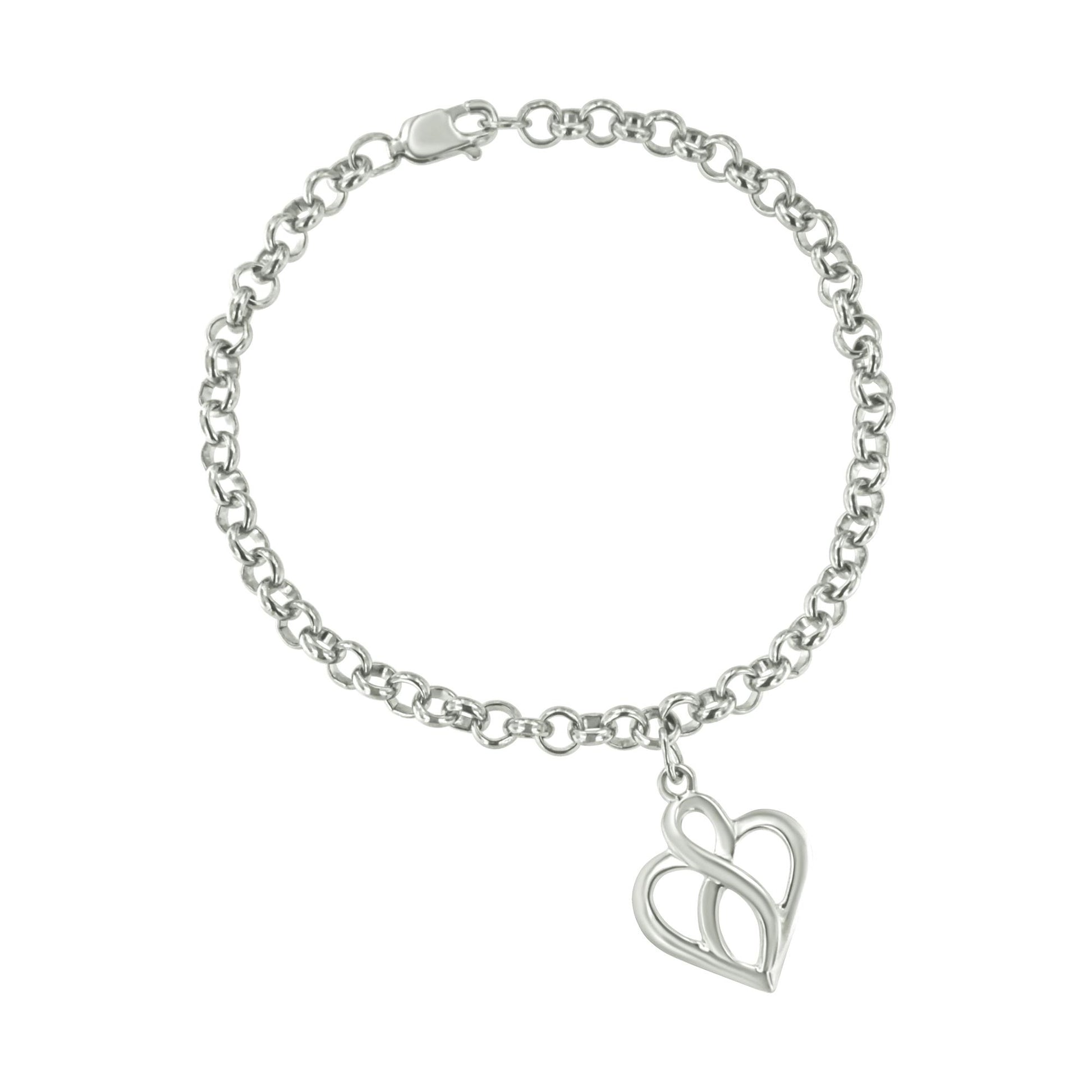 White metal bracelet with chain links and a heart-shaped pendant, shown from a top-down angle.