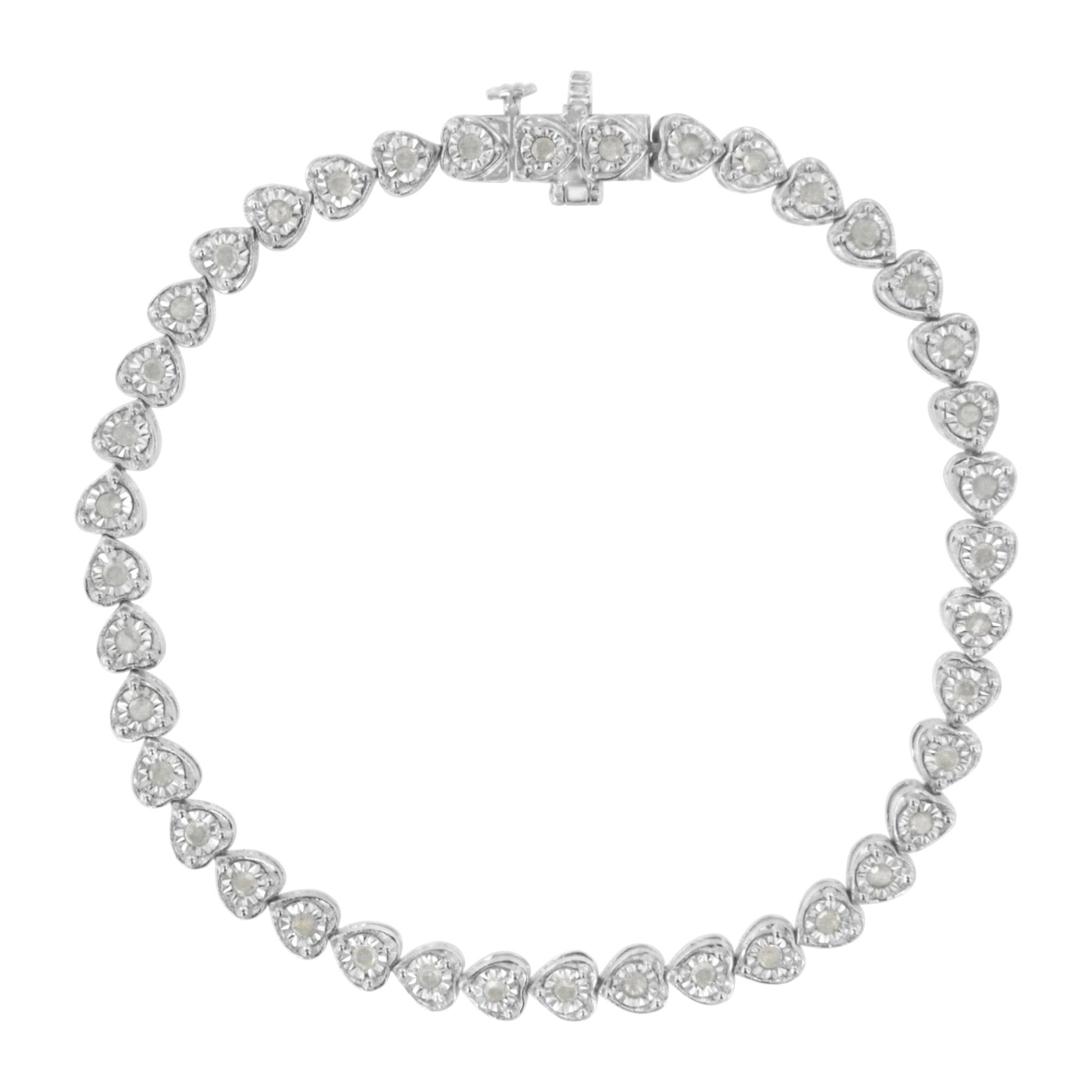 Top-down view of a white metal bracelet featuring heart-shaped links, each set with a round white gemstone in miracle setting, showcasing the clasp at the top center.