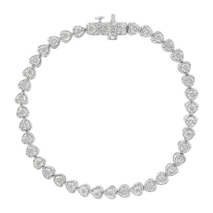 Top-down view of a white metal bracelet featuring heart-shaped links, each set with a round white gemstone in miracle setting, showcasing the clasp at the top center.