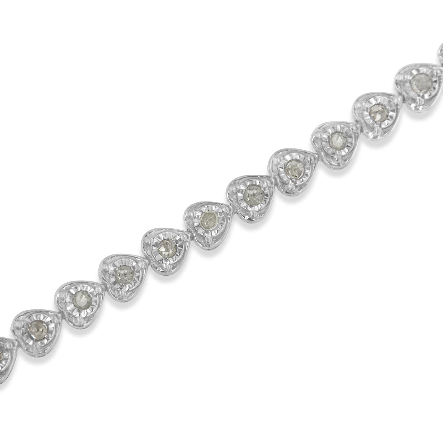 Diagonal close-up of a white metal bracelet featuring a series of heart-shaped links, each set with a round white gemstone in a miracle setting.