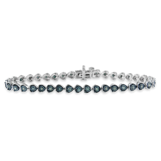 Bracelet with white metal and round blue gemstones set in heart-shaped settings, shown from the front angle.