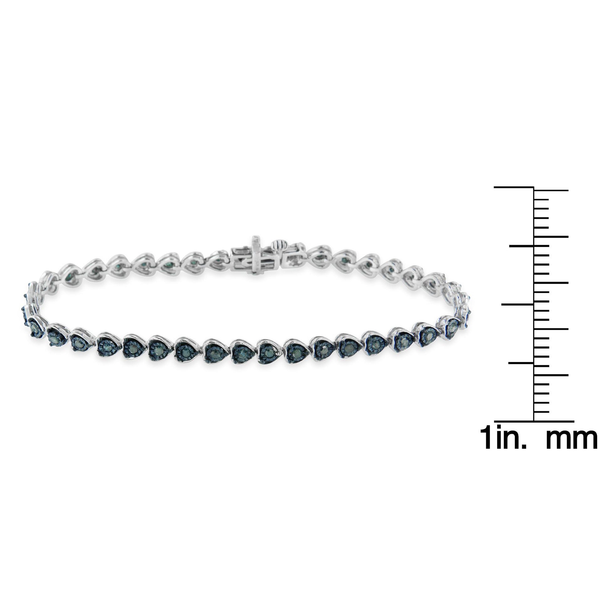 White bracelet with round blue gemstones in miracle setting, shown from front angle, displayed with a ruler for size reference.