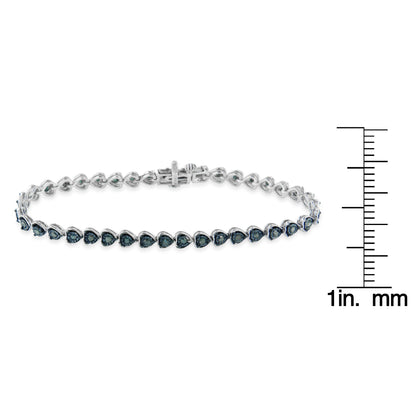 White bracelet with round blue gemstones in miracle setting, shown from front angle, displayed with a ruler for size reference.