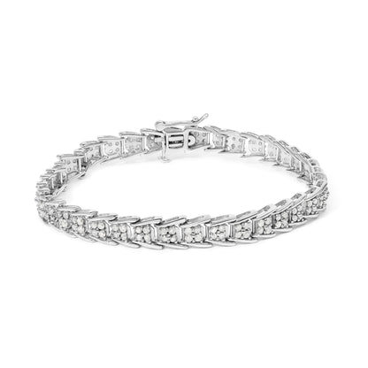 Close-up angled shot of a white metal bracelet featuring multiple round white gemstones in prong settings.