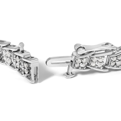 Close-up front angle of a white metal bracelet clasp with multiple prong-set round white gemstones.