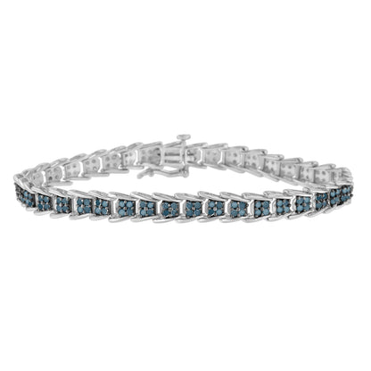 White metal bracelet with multiple linked segments, each set with clusters of round blue gemstones, shown from a front angle.