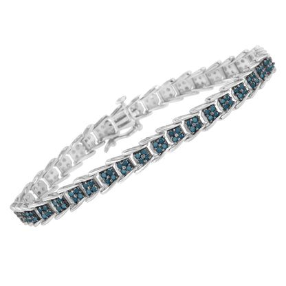 White metal bracelet with linked rectangular sections each set with small round blue gemstones, shown at an angle.