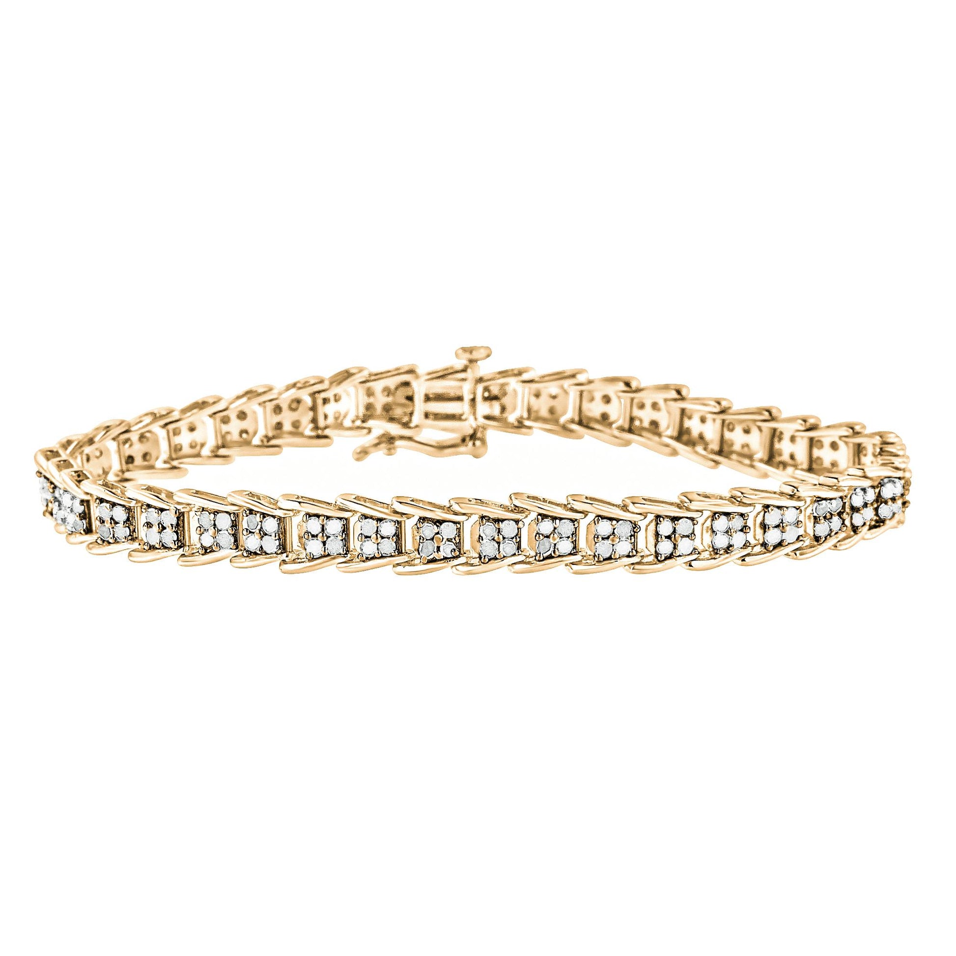 Yellow metal bracelet with white round gemstones in prong settings, angled side view.