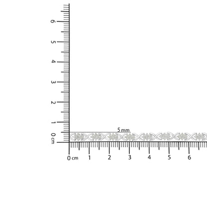 White metal bracelet with round white gemstones in prong settings, placed on ruler for size reference, front view.