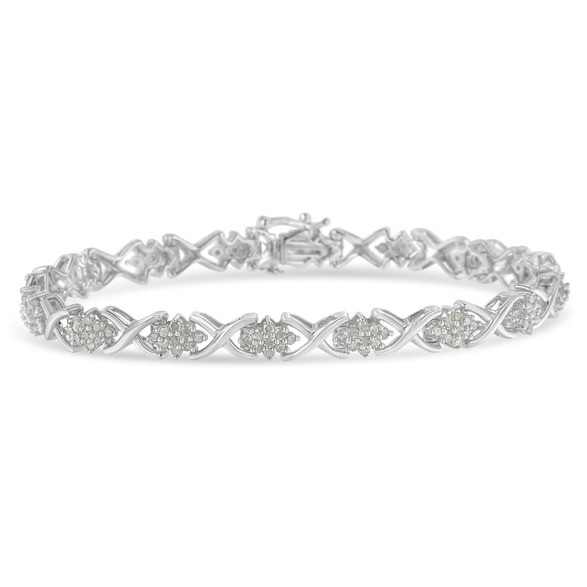 White metal bracelet with round white gemstones in prong settings arranged in a repeating pattern, shown from a slight front angle.