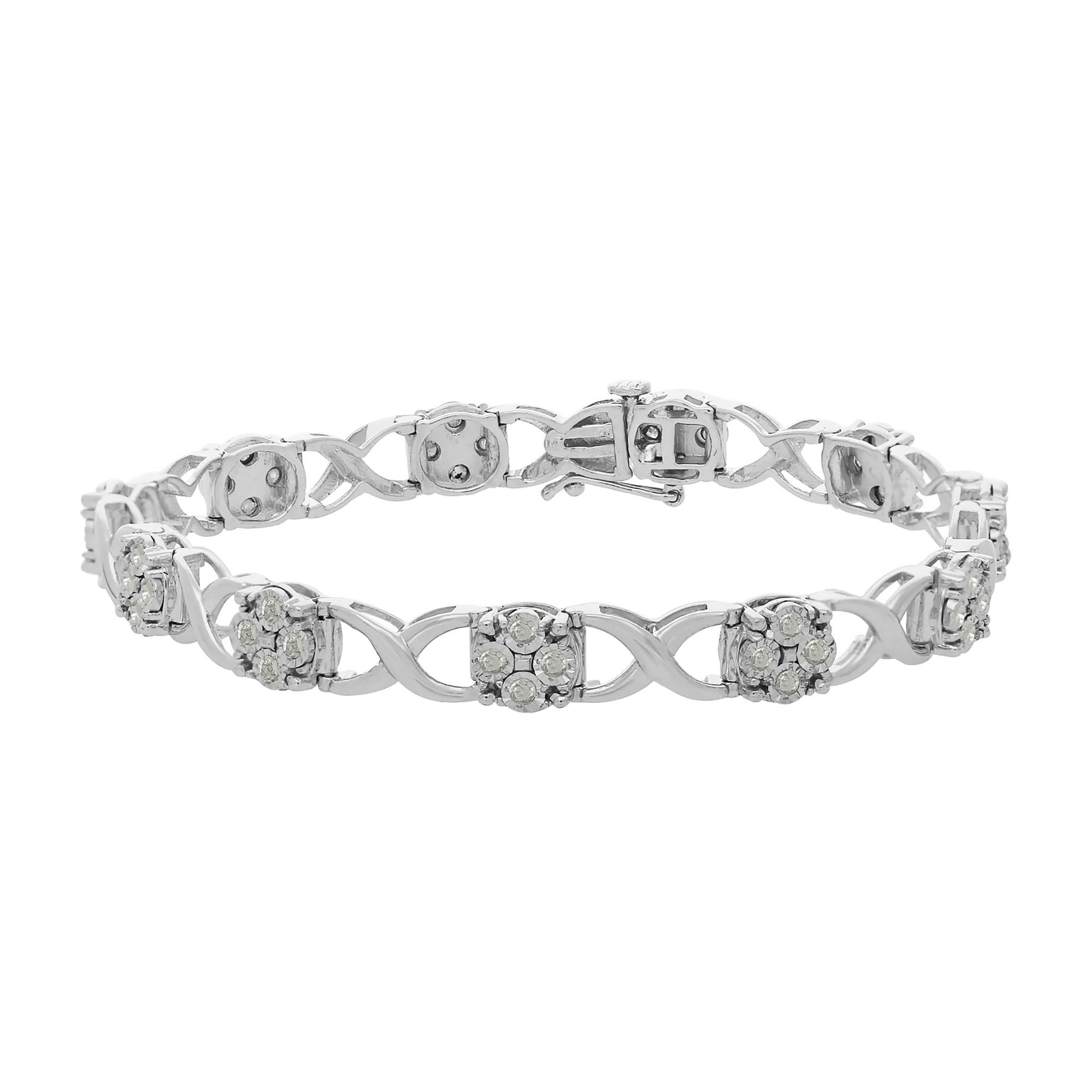 White metal bracelet with interlocking curved links and clusters of round white gemstones in prong settings, shown from a slightly elevated front angle.