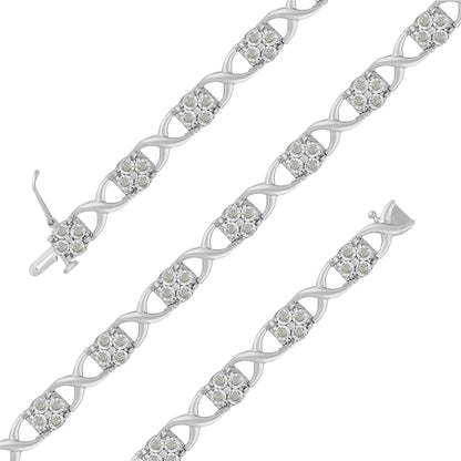 Top-down view of a white bracelet with alternating twisted links and clusters of round white gemstones in prong settings.