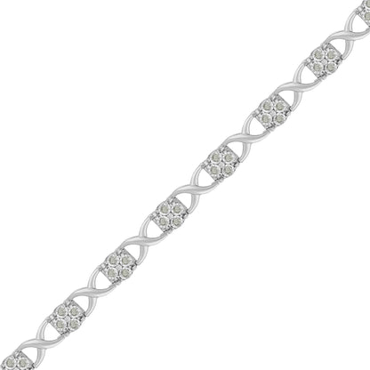 White metal bracelet with an alternating twisted link design and clusters of round white gemstones in prong settings, shown in a close-up diagonal view.
